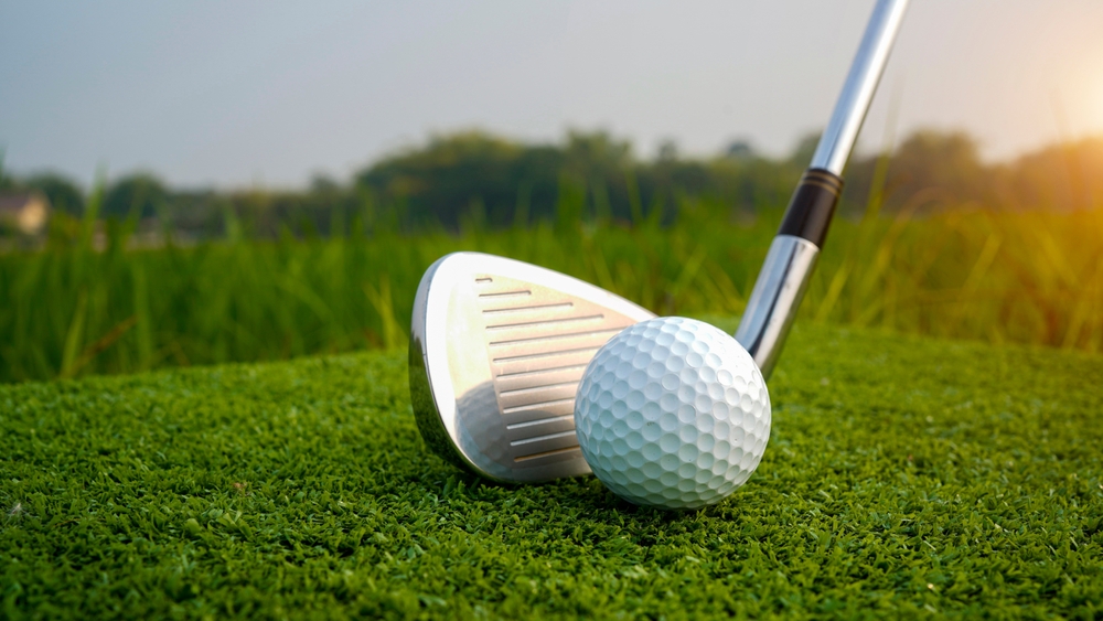 Close up of club and golf ball on the greens at a golf course near Cashiers North Carolina